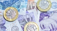 Pound dented by UK fiscal challenges