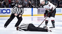 NHL linesman Ryan Gibbons taken off on stretcher after collision with Arizona's Liam O'Brien
