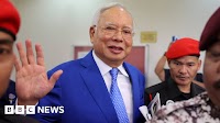 Malaysia halves ex-PM Najib Razak's jail term over 1MDB scandal