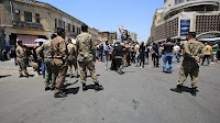 Bank owners and citizens protest deterioration of the Iraqi dinar following US ban on Iraqi banks