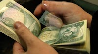 Some Americans Buy Iraqi Money, Hoping Trump Revalues