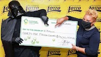 Jamaica's newest millionaire dresses as Darth Vader to receive mega jackpot prize