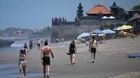 Power begins to return after outage in Indonesia's Bali island