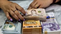 Why the Thai Baht Is Defying Economic Gravity