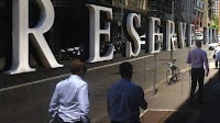 Australia's central bank cuts rates, open to more easing as global risks mount