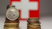 Swiss franc climbs as Swiss inflation flat