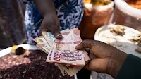 Ghana’s Cedi Weakens to Record Low on Dollar Demand for Imports