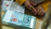 Ringgit Bears Emerge as Traders Weigh a Rate Cut in Malaysia