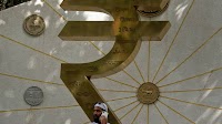Indian rupee down; likely saved from all-time low by RBI intervention