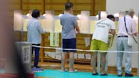 Exit polls show Japan's ruling coalition is likely to lose key election