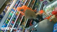 Appeal after shopkeeper fights off armed robber with mop