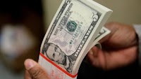 Dollar slides against dong