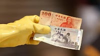 Taiwan dollar eases after historic surge as officials deny currency talks with U.S.