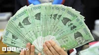 South Korea's currency slides on surprise rate cut