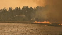 Precipitation stalls some wildfire growth; repatriation begins in Pelican Narrows