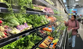 US economy expanded at sluggish 0.7% in fourth quarter, government says, downgrading first estimate