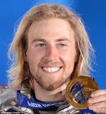 Say cheese!: US gold medalist Sage Kotsenburg poses with his medal on the podium of the Men&#39;s Snowboard Slopestyle - article-2554645-1B4EC6BE00000578-538_634x683