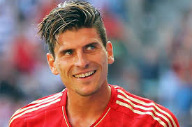 Bayern Munich forward Mario Gomez is set to remain at Allianz Arena, despite the ongoing speculation about his move to Napoli, according to his agent. - gomez-5-6-13