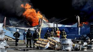 Russian attack on Ukrainian ammunition warehouse triggers waves of blasts, killing 38