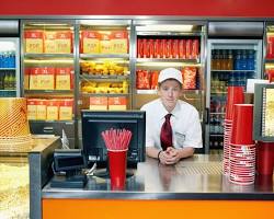 Image of teenager working at a movie theater
