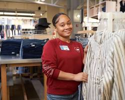 Image of teenager working at a clothing store