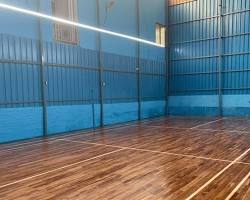 Image of professional badminton court with wooden flooring