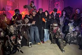 Nick Cannon’s Twins Tower Over Dad at Halloween Event