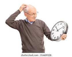 Image of someone looking confused at a clock