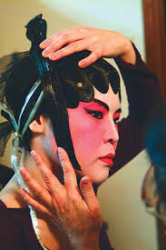 Della Tse places real human hair on Margaret Tan. During this lengthy process, Wong and Tse reminisced over their performance days. - chinese_opera_2