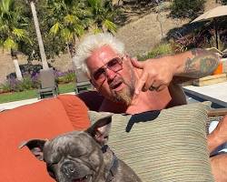 Image of Guy Fieri with his dog Cash