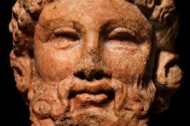 Archaistic Rosso Antico Herm Head of Dionysus. SI_RM_1081ew. Reference #SI_RM_1081; CivilizationRoman, 100 C.E. - 200 C.E.; Size10.2 cm; ConditionMissing ... - SI_RM_1081ew