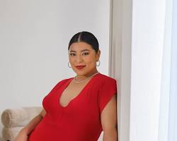 Image of Woman in red dress with statement earrings