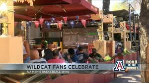 Arizona wildcat fans celebrate the big win at Main Gate Square