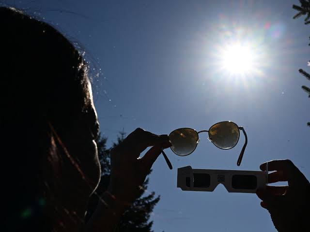 Solar eclipse peaks over Manchester at 7.10pm today as UK sees best coverage in 27 years; experts warn never to look directly at the Sun