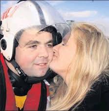 Courtown RNLI member Robert Ireton gets a kiss from fiancee Casey Lawlor at the charity swim there on Christmas Day - the very day they got engaged! - 77f13969-54f6-40eb-8e55-8a0cf14c20bd