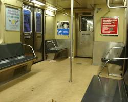 Image of crowded subway bench in New York City