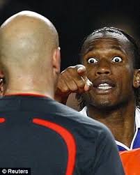 Eye sore: Didier Drogba with Tom Henning Ovrebo - article-2125500-04D5E7C9000005DC-188_306x382