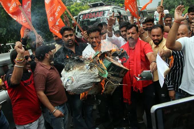 Bajrang Dal activists protest in Jammu over alleged demolition of 100-year-old Hindu temple in Pakistan; burn effigy, flag, reject rain-collapse excuse