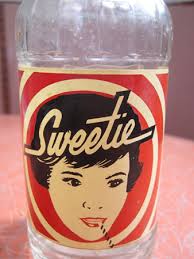 There had to have been at least two flavors of Sweetie soda as some of the bottles are only two colors with the red and white reversed in the graphics. - Sweetie-soda_1915
