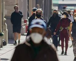 Image of people wearing and not wearing masks in NYC