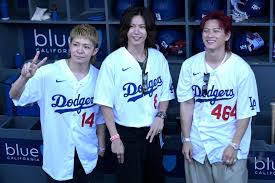Number_i OFFICIAL members at a Cardinals-Dodgers baseball game in Los Angeles
