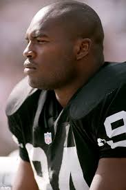 Murder charges: Former NFL Defensive end for the Oakland Raiders Anthony Smith has been charged with four counts of first-degree murder - article-2169838-13F4C9BB000005DC-529_468x705