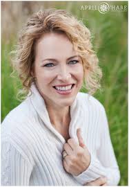 A pretty blonde lady with curls snuggles in her white long sleeved sweater for her headshot - Denver-Headshot-Photographer-Cherry-Creek-Colorado-2