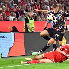 Michael Olise and Tom Rothe during Bayern Munich vs Union Berlin Bundesliga match