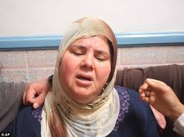 Widow: Mbarka Brahmi cries after she was informed that her husband, Mohammed Brahmi, died from his wounds at Mahmoud Materi Hospital, north of Tunis, ... - article-2379077-1AFDFB6A000005DC-752_634x474