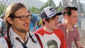 Band members of Old Crow Medicine Show observe the masses from the dugout at the Snow King Ball Field in Jackson Hole, WY on July 4th, which they say is the ... - old_crow_medicine_show_01