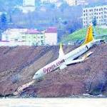 Skids after landing, hangs cliff