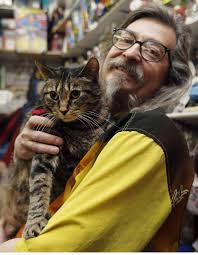 Larry Jensen holds Eddie the now-slimmer fat cat. Don&#39;t worry. You can still keep track of Eddie and his weight-loss progress on his new Facebook page. - 140506-_FAT_CAT_3_17567341