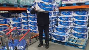 Customer picking up toilet paper during the US Canada trade dispute