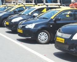 Image of Yellow and black government taxi in Goa